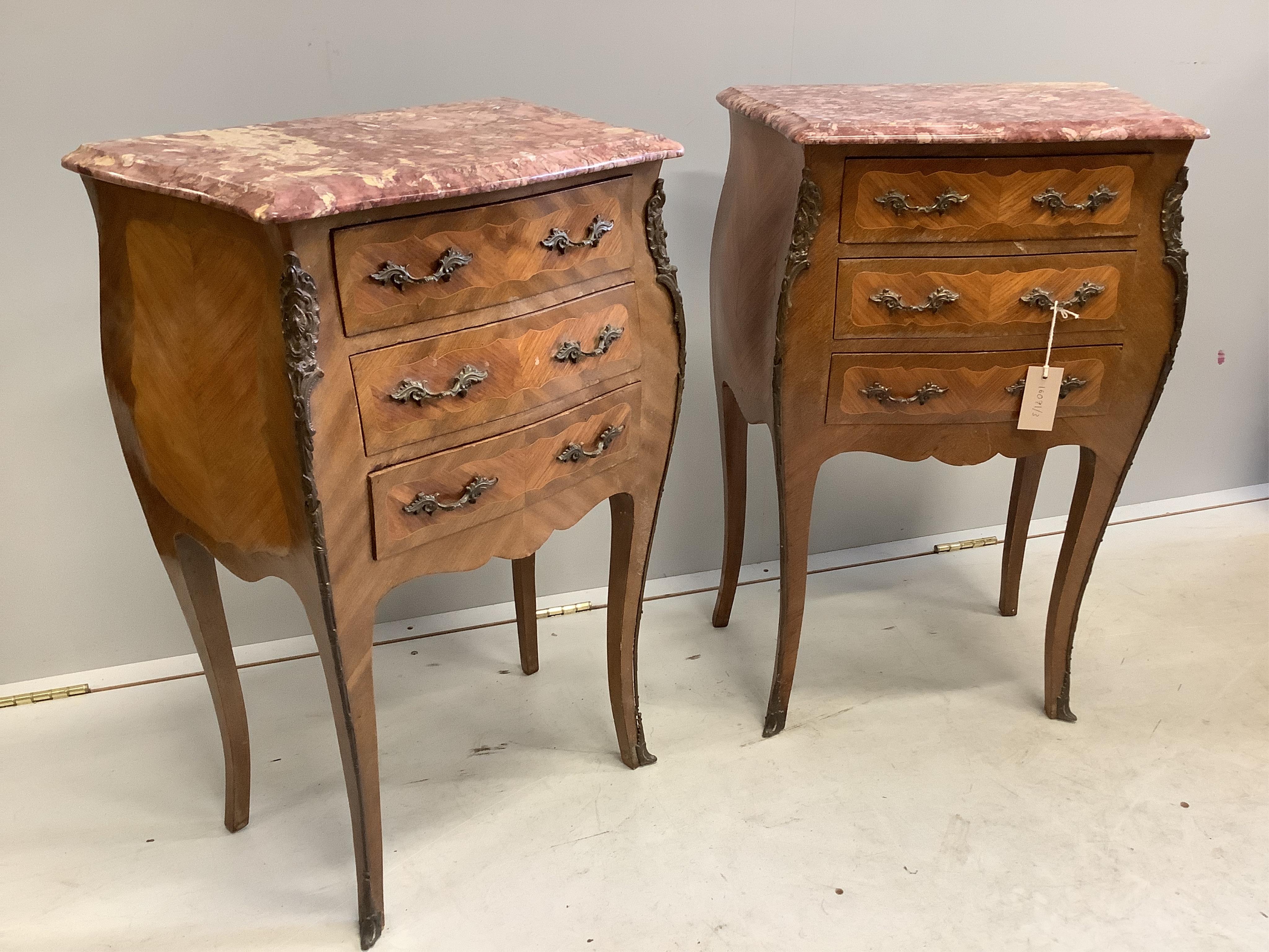 A pair of Louis XVI style kingwood marble top bombe bedside chests, width 48cm, depth 29cm, height 72cm. Condition - fair to good